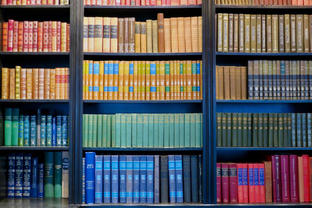 Several shelves of multicolored books.